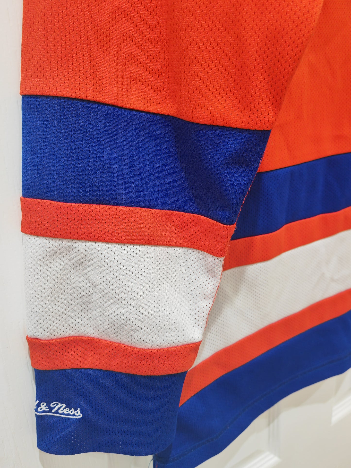 Mitchell & Ness New York Knicks Hockey Style Jersey, Orange/Blue, Size Medium
