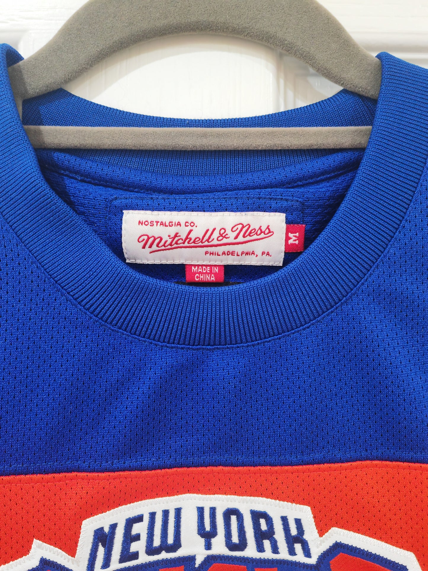 Mitchell & Ness New York Knicks Hockey Style Jersey, Orange/Blue, Size Medium